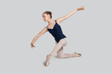 Young ballerina practising ballet moves