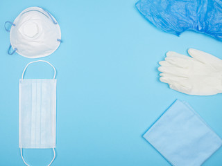 Medical personal protective equipment on a blue background.