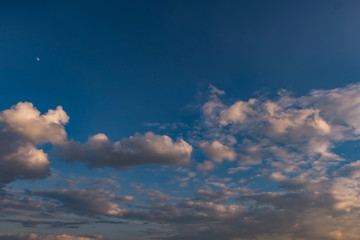 dark Blue sky background with tiny stratus cirrus striped clouds. Clearing evening and Good windy weather