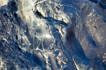 The texture of black volcanic stone. Natural background.