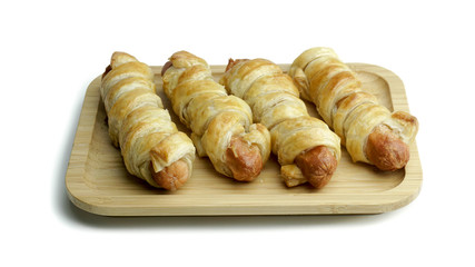 sausage rolls baked in dough. Isolated white background with clipping path