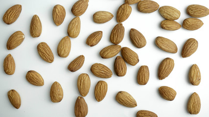 Almond nuts isolated with white background.