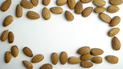 Almond nuts isolated with white background.