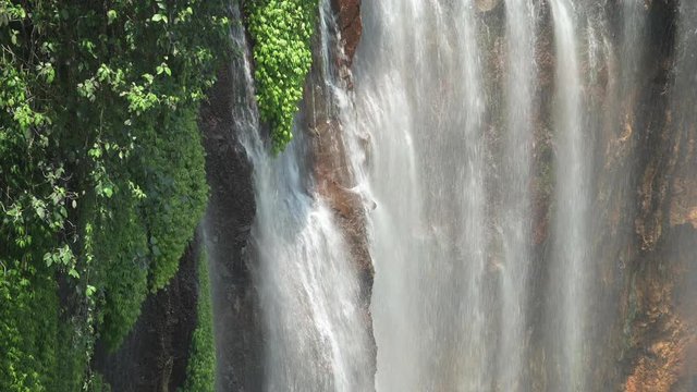 Stunning close-up view of the Tumpak Sewu Waterfalls also known as Coban Sewu. Tumpak Sewu Waterfalls are a tourist attraction in East Java, Indonesia.