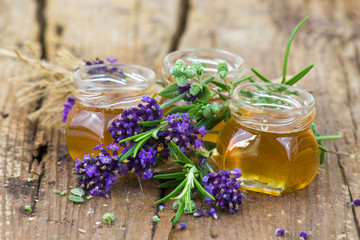 Obraz na płótnie Canvas herbal honey with fresh herbs