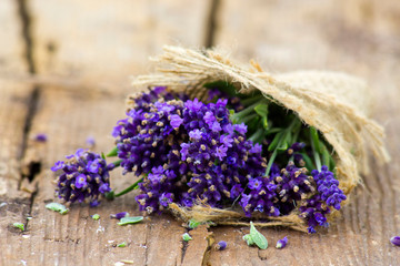 Bunch of lavender flowers on old wooden background