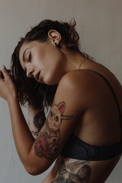 Sexy tattooed woman wearing underwear