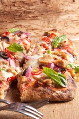Tasty vegetarian pizza with cherry tomatoes, mozzarella cheese and basil
