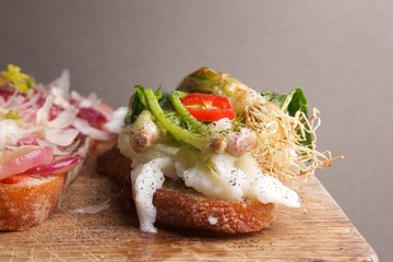 Assorted bruschetta with various toppings. Appetizing bruschetta.