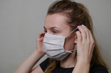 Young girl in a medical mask