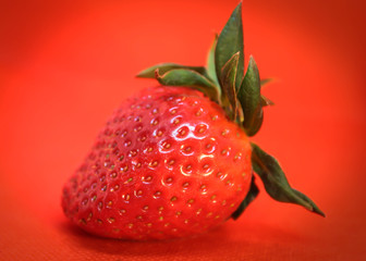 fresh strawberry on red background