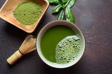 Green matcha tea drink and tea accessories on white background. Japanese tea ceremony concept. Detox tea. Antioxsidant drink