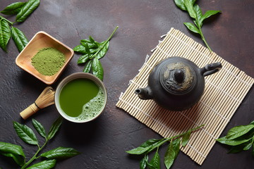 Green matcha tea drink and tea accessories on white background. Japanese tea ceremony concept....