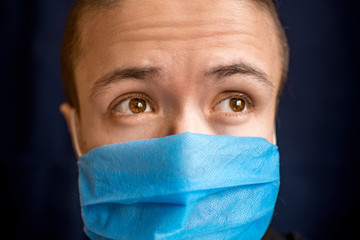 the man in a medical mask hopes that the coronavirus pandemic will end soon and not lose optimism