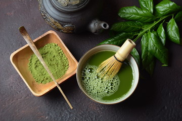 Green matcha tea drink and tea accessories on white background. Japanese tea ceremony concept. Detox tea. Antioxsidant drink