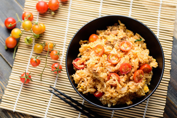 Fried rice with minced pork and tomato in a bowl, Asian food, Top view