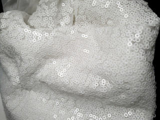 Fototapeta premium close up on shiny bridal white round sequin fabric texture detail 