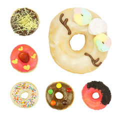 Delicious and colorful doughnuts on white background, top view. Homemade doughnuts.