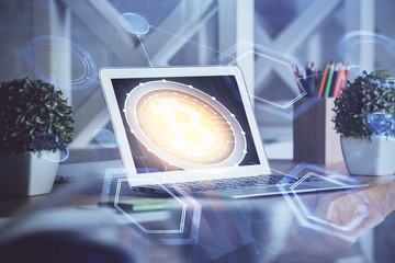 Multi exposure of blockchain and crypto economy theme hologram and table with computer background....
