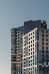 Fototapeta na wymiar Futuristic skyscrapers in blue-gray colors