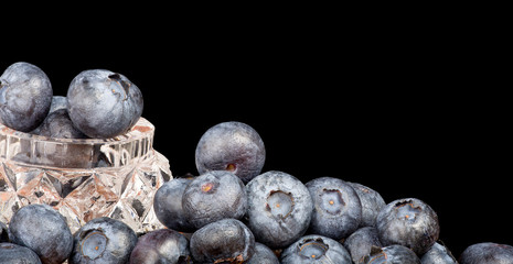 heap of blueberry isolated on black background