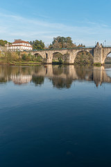 Fototapeta na wymiar Ancient roman bridge of Ponte da Barca, ancient portuguese village in the north of Portugal.