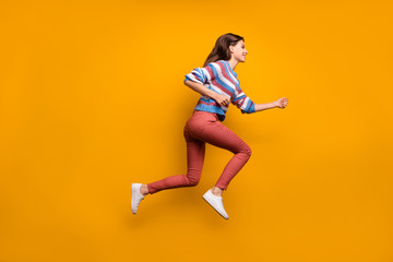 Fototapeta na wymiar Full size profile side photo of content lovely youth girl jump run after fall bargain novelties wear good look clothes pullover shoes isolated over bright color background