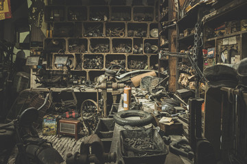 old abandoned mechanical workshop with many messy things