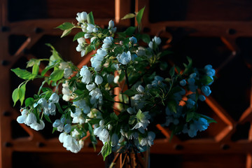 bouquet flowers of apple tree branches in a vase, a beautiful bouquet in the spring loft interior
