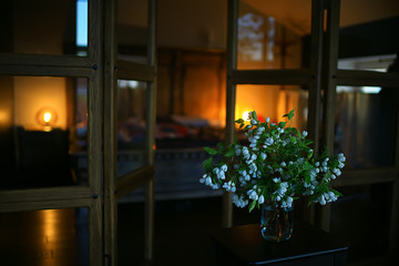 bouquet flowers of apple tree branches in a vase, a beautiful bouquet in the spring loft interior