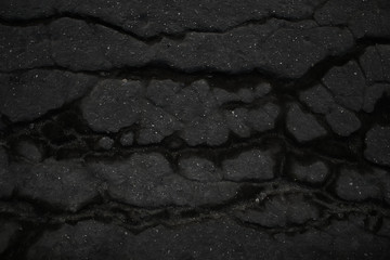 asphalt in cracks texture / abstract background cracks on asphalt road