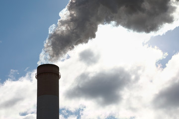 Pollution of the environment: a pipe with smoke