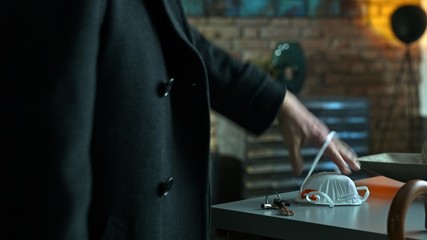 Man arriving home leaving virus protection mask