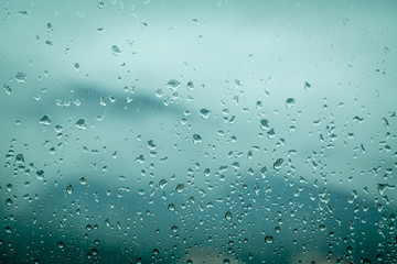 a scene of rain in the window