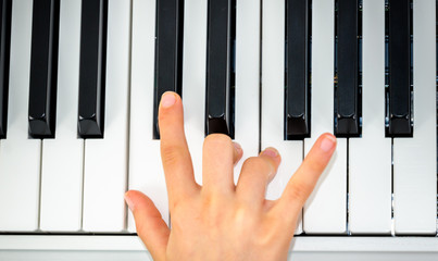 close-up of piano keys. close frontal view, black and white piano keys, viewed from side, musician...