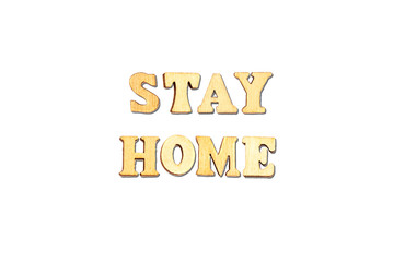 forming word  stay  home with wooden alphabets 