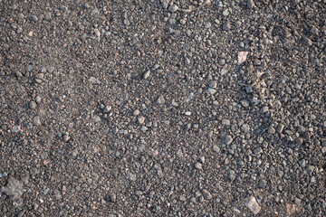 Background image of the surface of a gravel walking path