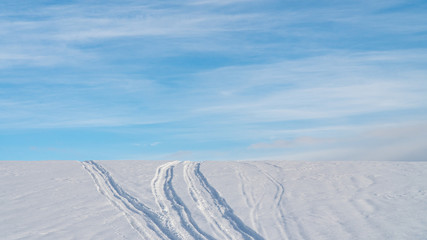 Landscape of snow covered countryside with beautiful sky
