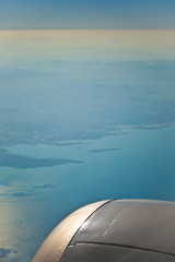 View of the Mediterranean from the porthole of an airplane