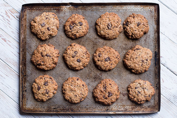 chocolate cookies on a baking tray in zenithal view and horizontal position