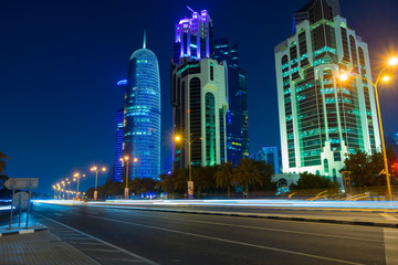 Fototapeta premium Night urban skyline of modern skyscrapers in Financial District in Doha, Qatar