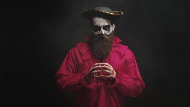 Adult man with long beard dressed up like a spooky captain