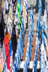 Clothes hanging out on rope to dry