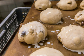 Preparing the chocolate buns to be baked