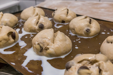 Preparing the chocolate buns to be baked