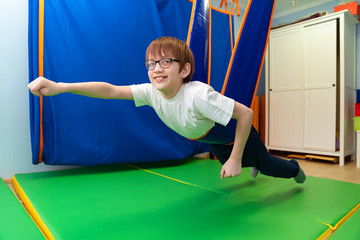 little boy in tape sensory integration