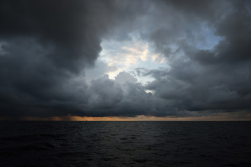 Terrific cloudscape. Sailing in a thunderstorm. Dramatic sky. Sunlight through the clouds. Baltic...