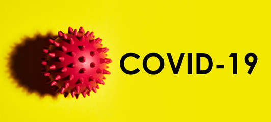 Inscription COVID-19 on yellow background. World Health Organization WHO introduced name for chinese virus 2020.disease named: Coronavirus, COVID-19 SARS, Coronaviridae , SARS-CoV, SARSCoV , MERS-CoV