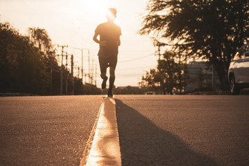 Blurry subject Man running on road
