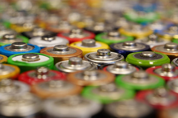 Many multicolored used batteries